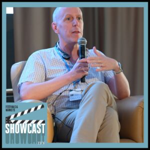 A photo of screenwriter and author John August at the 2024 AVP Summit held in Reggio Calabria, Italy. August was interviewed by the TFV Network as part of its Showcast podcast series.